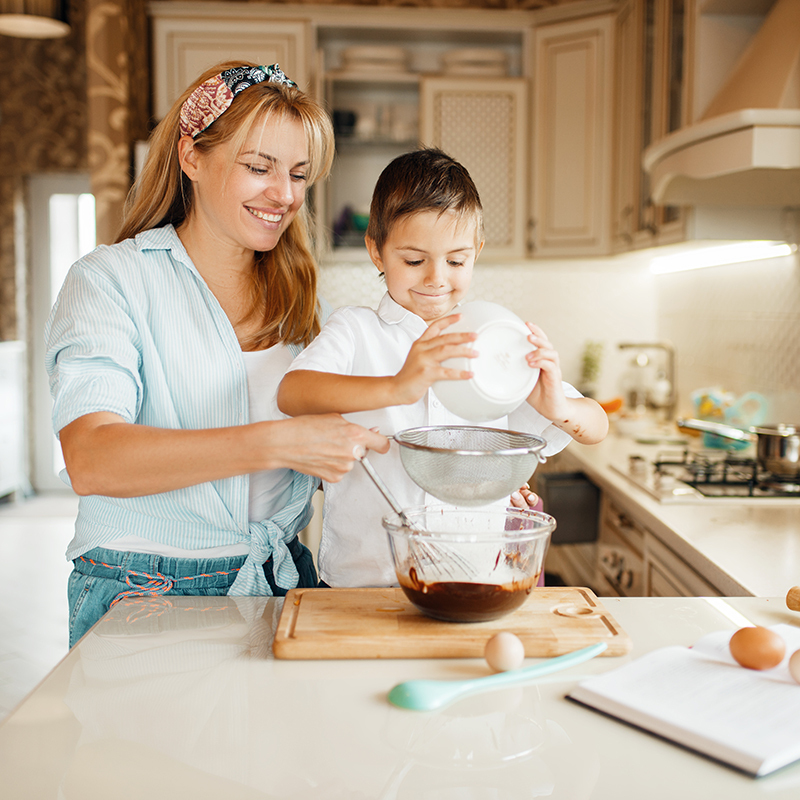 This image has an empty alt attribute; its file name is mother-with-son-mixing-melted-chocolate-bowl.jpg