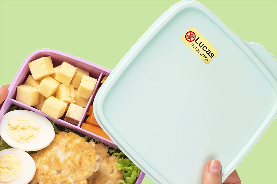 Allergy alert name sticker on a lunch box