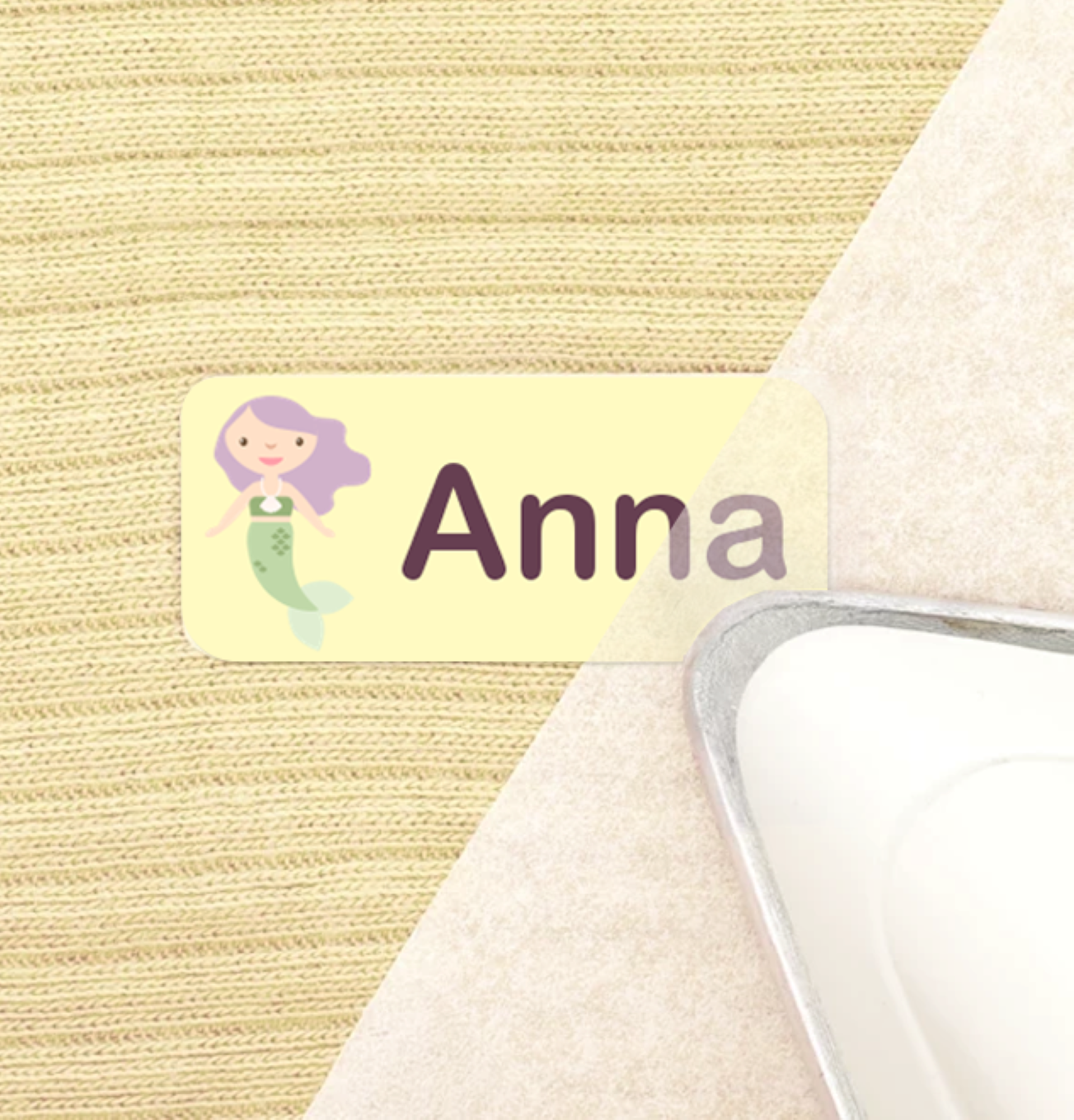 Iron applying a personalised iron-on label to fabric