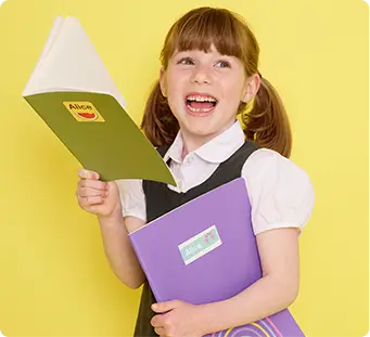 Girl reading from notebook labelled with maxistickers